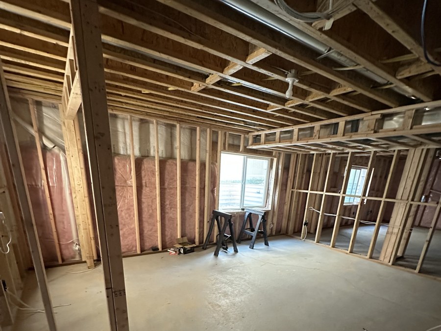 Basement insulation and framing in progress on a Stauffer Custom Contracting project